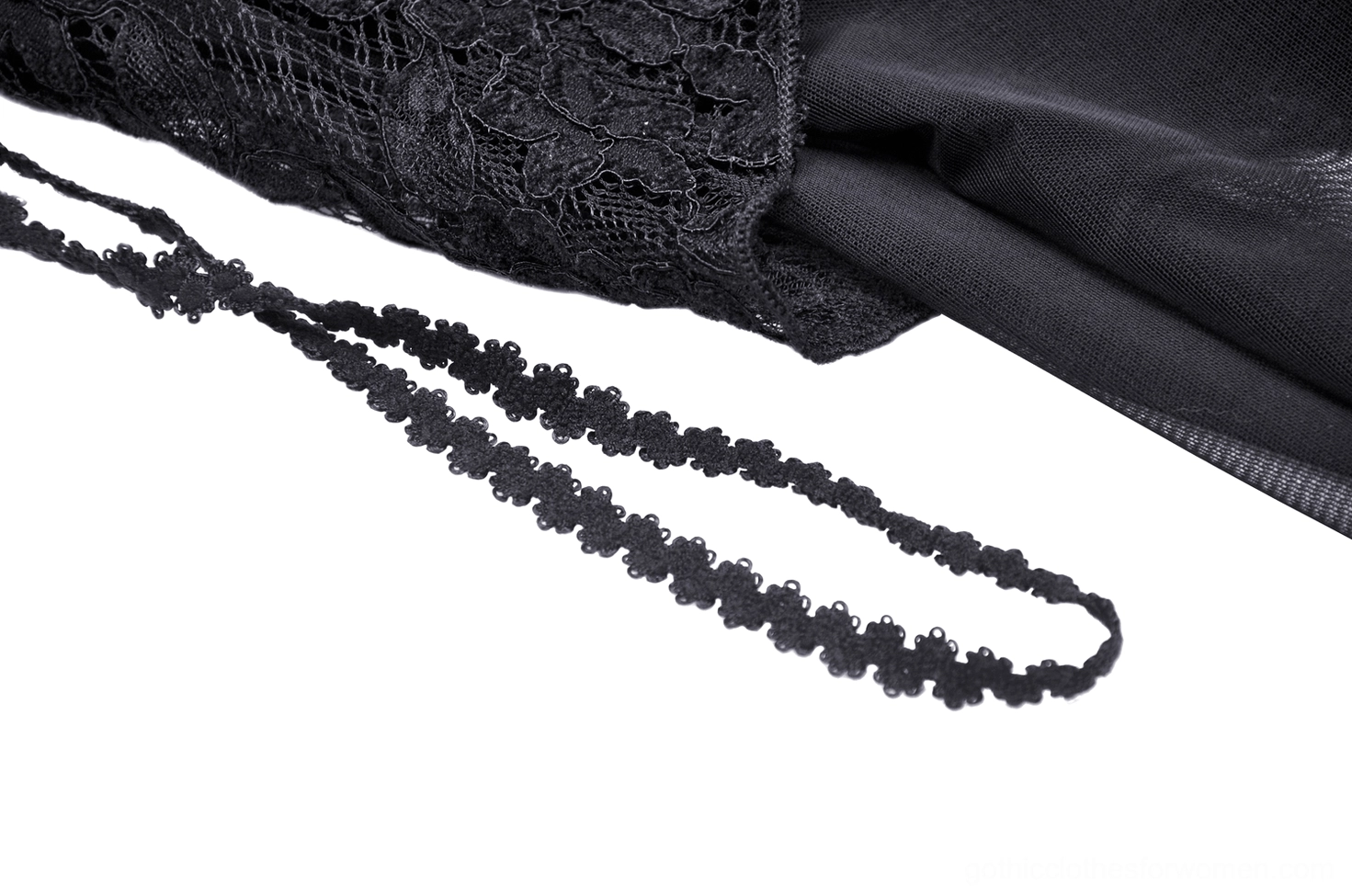 Close-up detail of black lace mesh fabric with beaded chain trim, showcasing intricate gothic lace embellishments