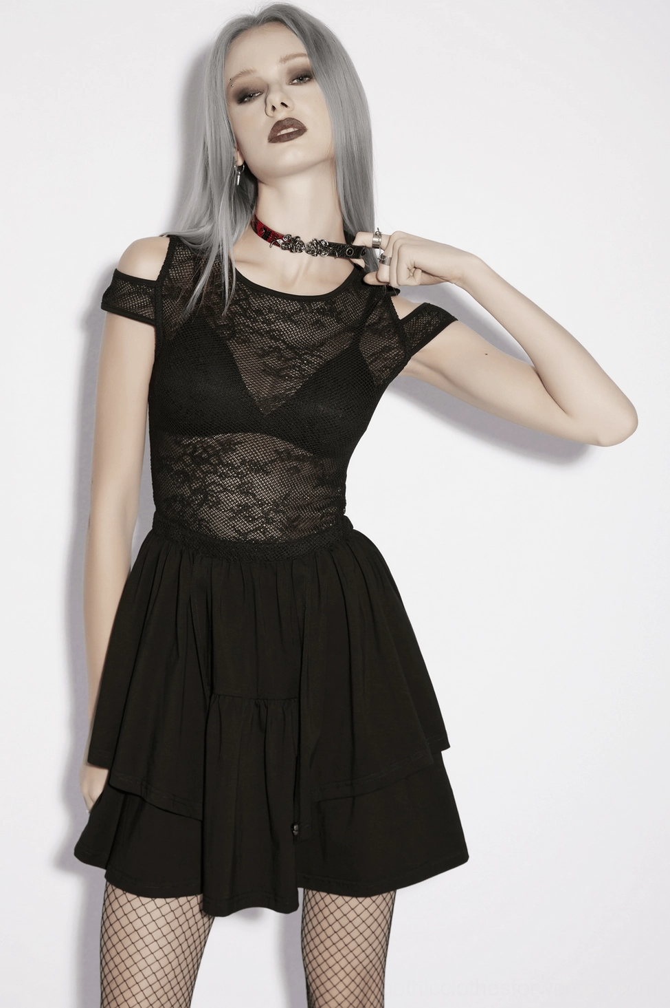 Sheer lace cold shoulder mini dress styled with gothic accessories and platform boots
