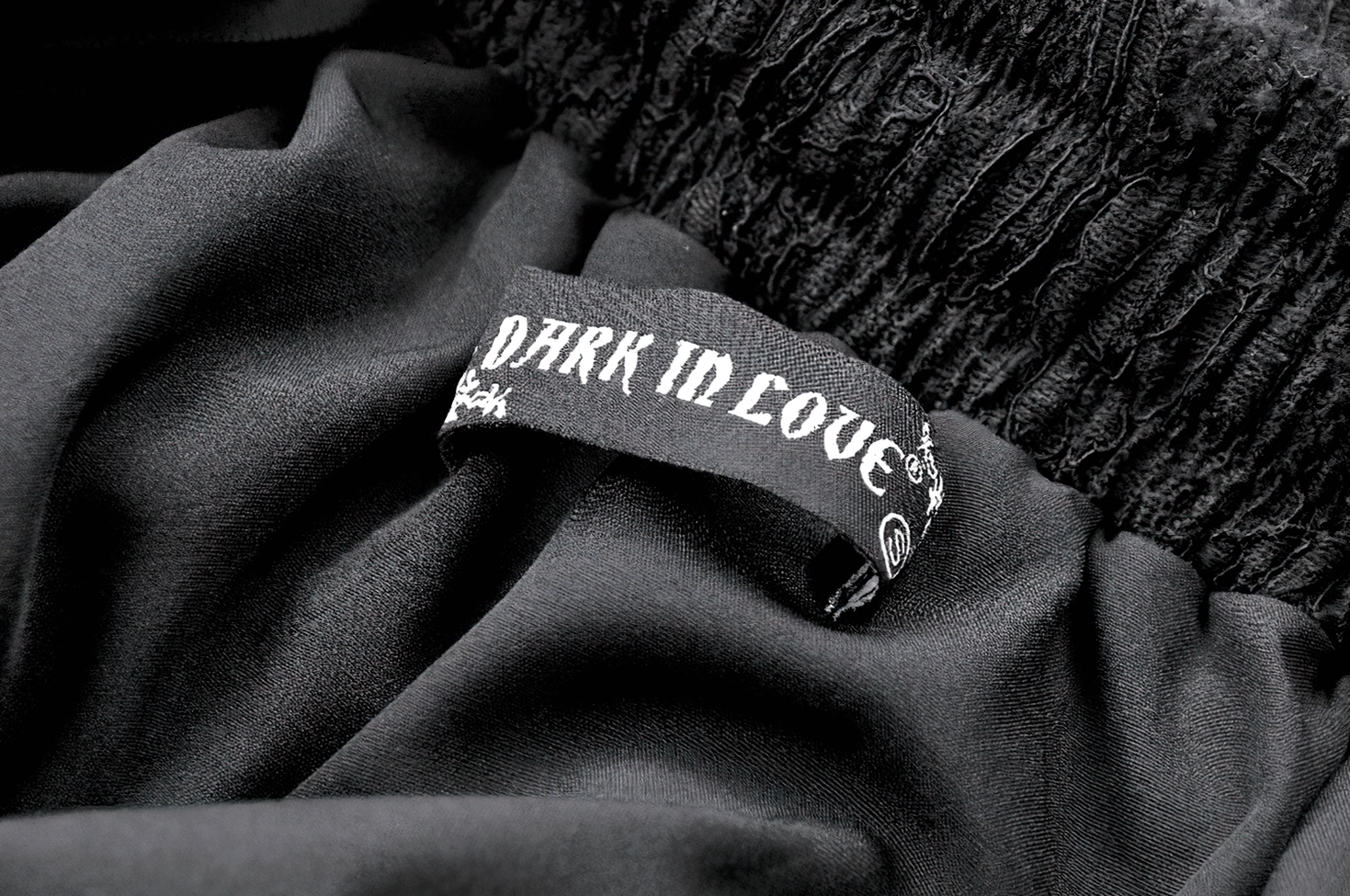 Black lace ruffle skirt close-up showing intricate ruffle construction and tiered layers