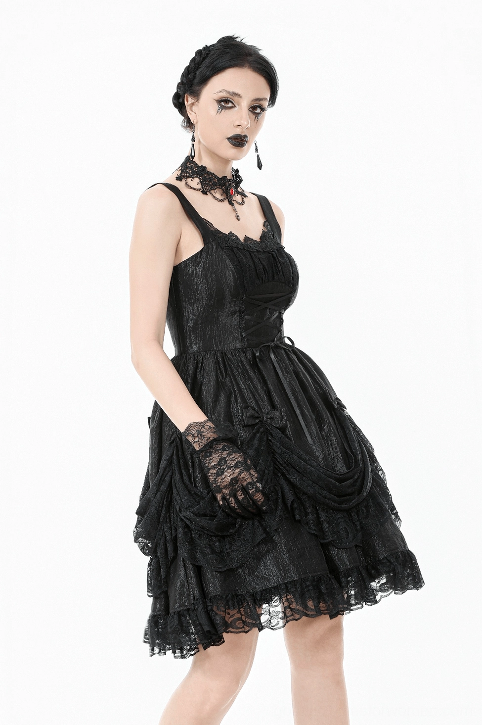 Black lace slip dress front left angle on model, showcasing lace strap and delicate lace detailing with goth accessories