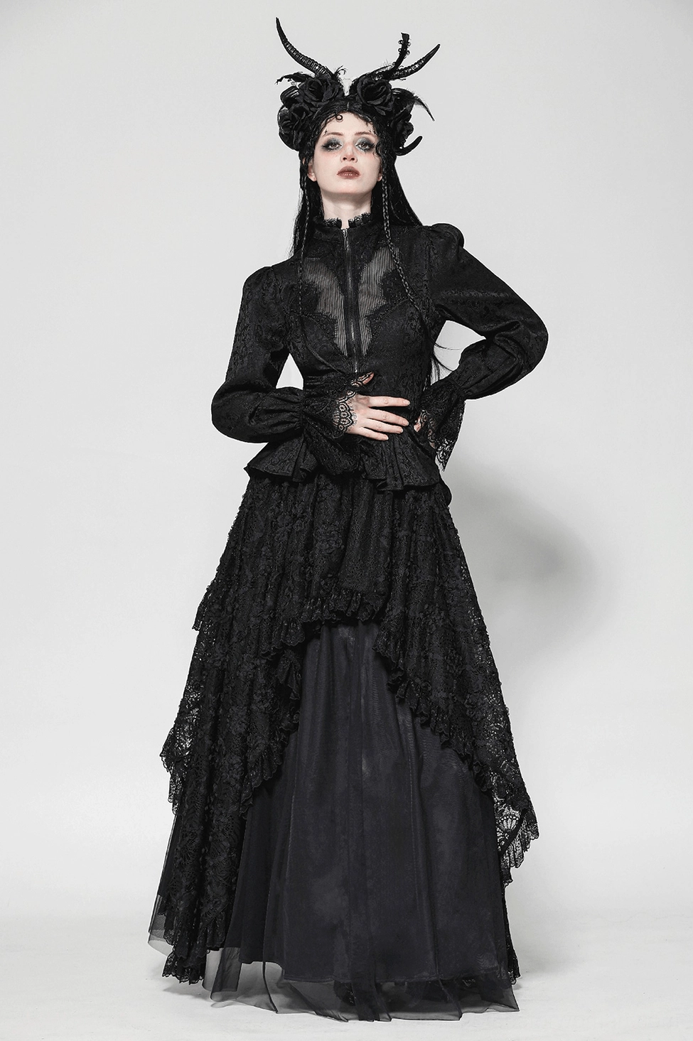 Black lace tailcoat showing front zipper closure, peplum waist, and high-low hemline profile