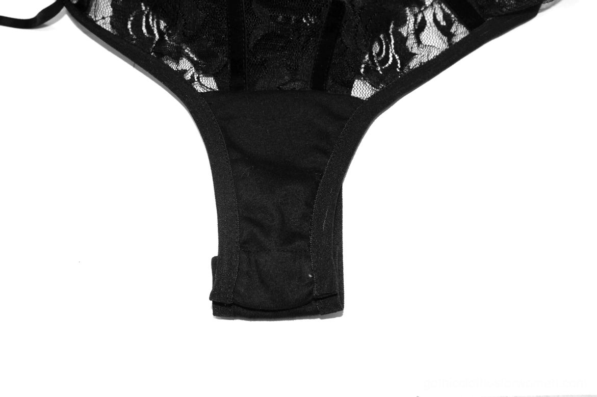 Black lace thong bodysuit bottom close-up showing high-cut leg design and floral lace panel detail