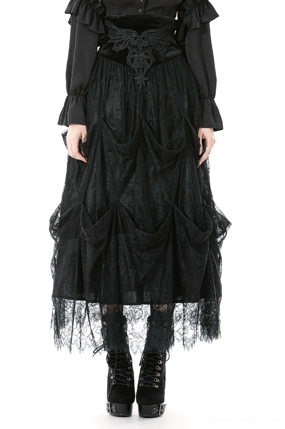 Black lace tiered high-waist maxi skirt worn by female model with matching black blouse, front full-body view showing draped lace panels and scalloped hemline in studio setting