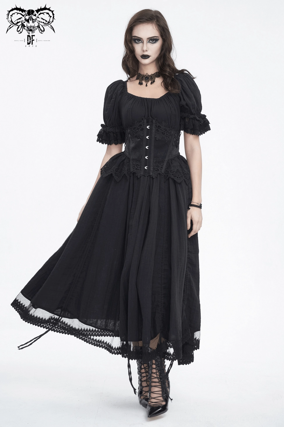 Full body shot of gothic model wearing black lace underbust corset showing complete silhouette and styling potential