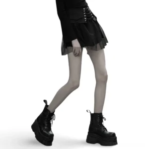 Black lace-up gothic mini skirt front view on model with sheer mesh tulle hem and structured waistband