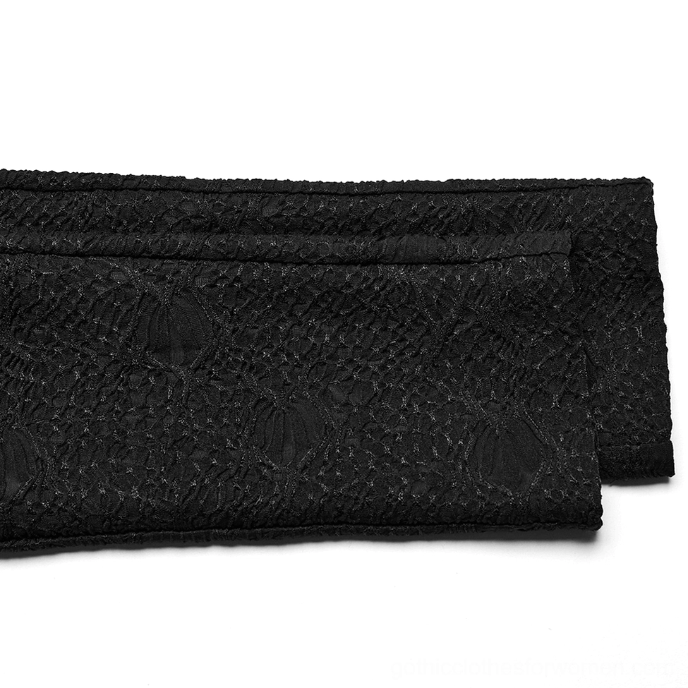 Close-up of black lace waistband showing intricate embossed skull pattern and premium fabric construction