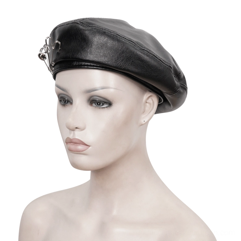 Three-quarter front angle of black faux leather gothic beret on mannequin with partial safety pin decoration visible