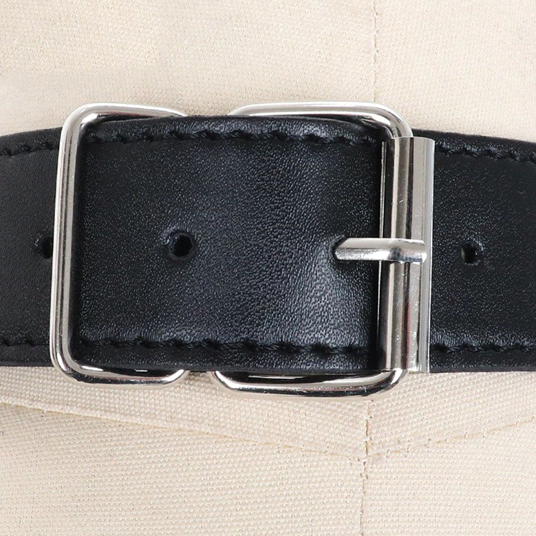 Alternative fashion chest harness highlighting faux leather straps and decorative chain elements