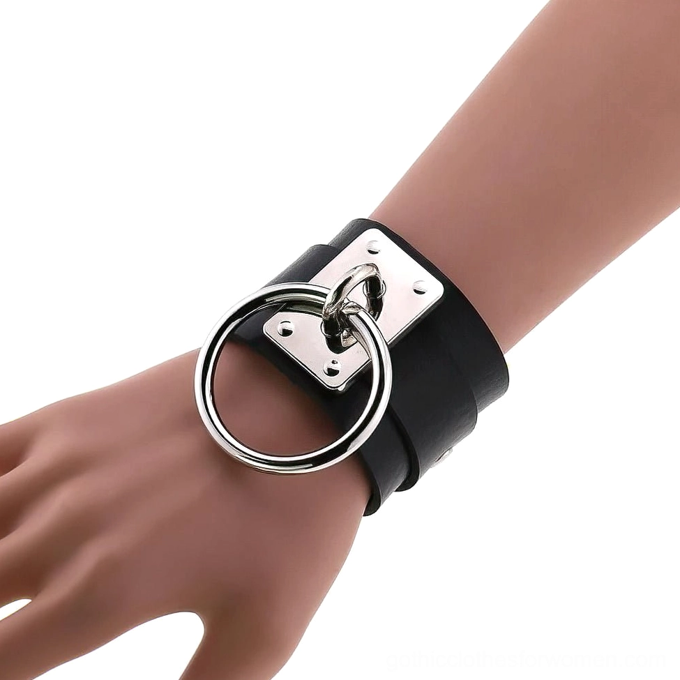 Black leather gothic bracelet close-up detail view showing metal hardware and strap construction