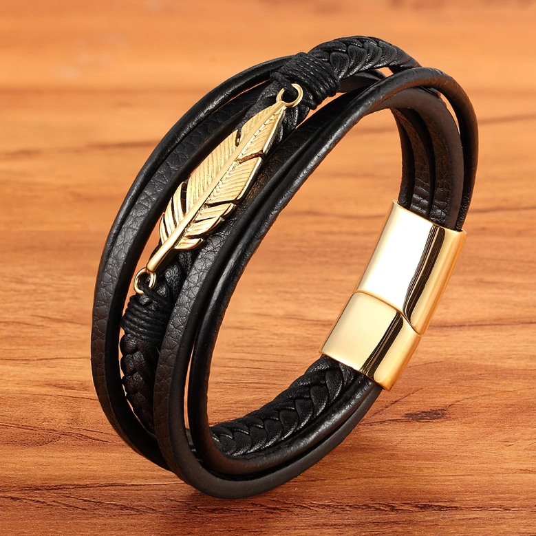 Black leather gothic bracelet with gold feather, side angle photography showing leather craftsmanship