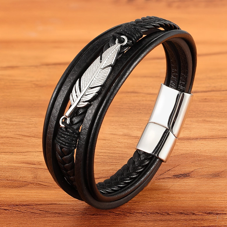 Black braided leather gothic bracelet with silver stainless steel feather pendant, lifestyle side view