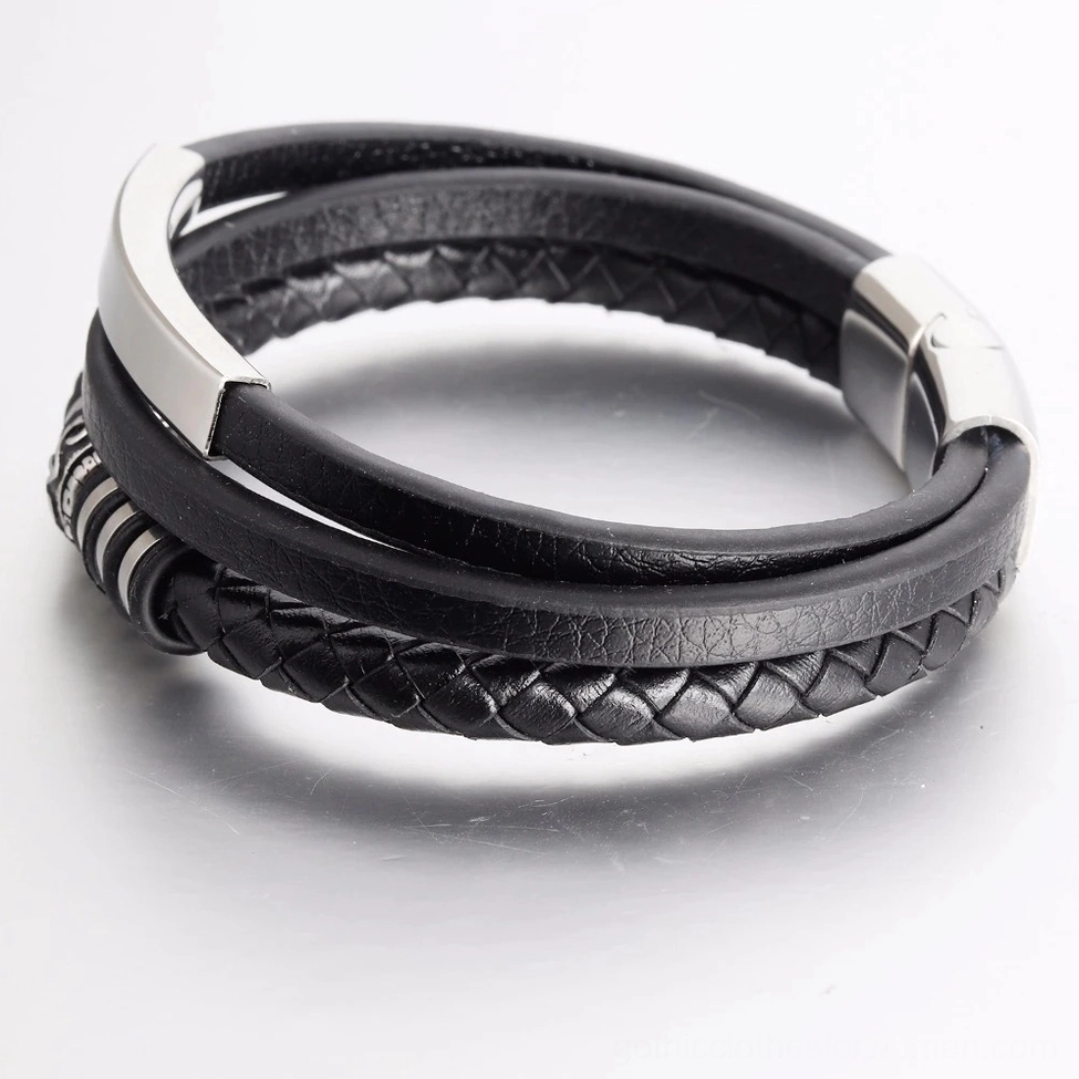 Black leather gothic bracelet angled view showing smooth and braided leather textures with silver accents