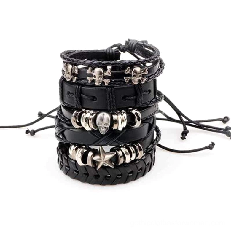 Punk rock leather bracelets with adjustable pull-tie closures and skull ornaments, complete set on black background showcasing layered strap styles