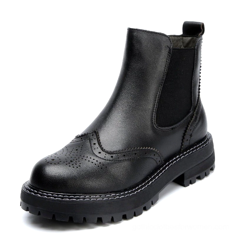 Black genuine leather gothic Chelsea platform boots with brogue detailing - front three-quarter view