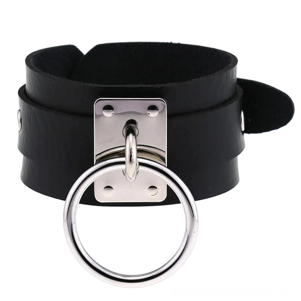 Black leather gothic cuff bracelet with double-layer strap and silver metal ring hardware, flat lay overhead view
