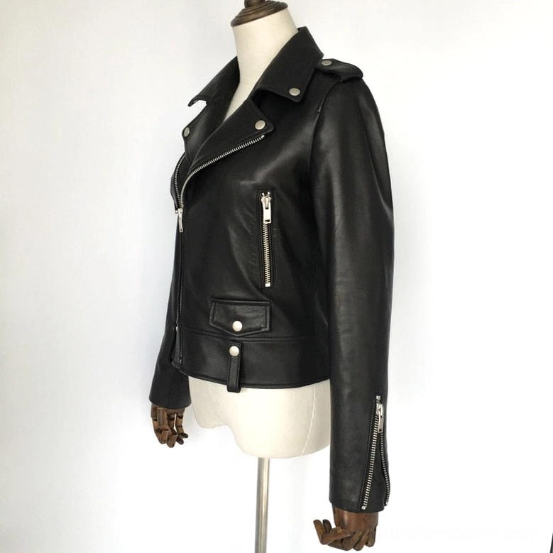Side three-quarter view of women's black sheepskin leather motorcycle jacket, showing zippered cuffs, chest pocket, and shoulder snap buttons