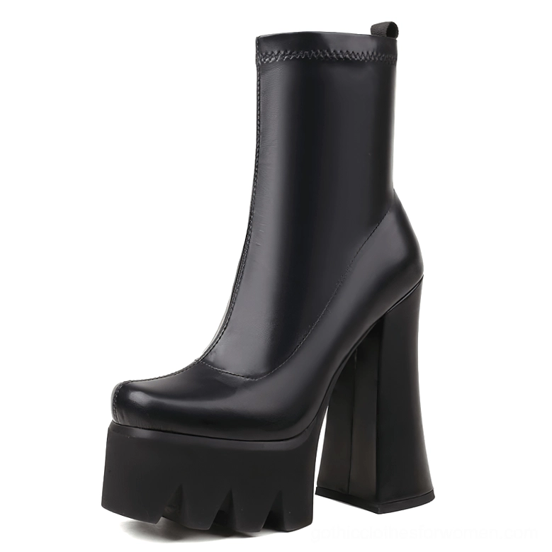 Black genuine leather gothic platform boots with chunky square heel and serrated sole, front three-quarter view