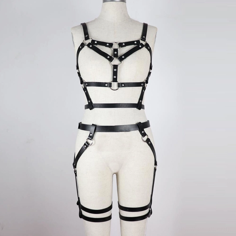 Gothic black PU leather body harness front view highlighting crisscross strap design and metal hardware details