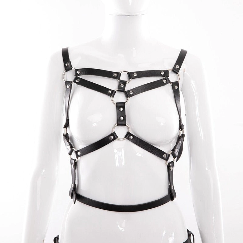Black PU leather body harness worn with denim jeans showing versatile styling for alternative fashion