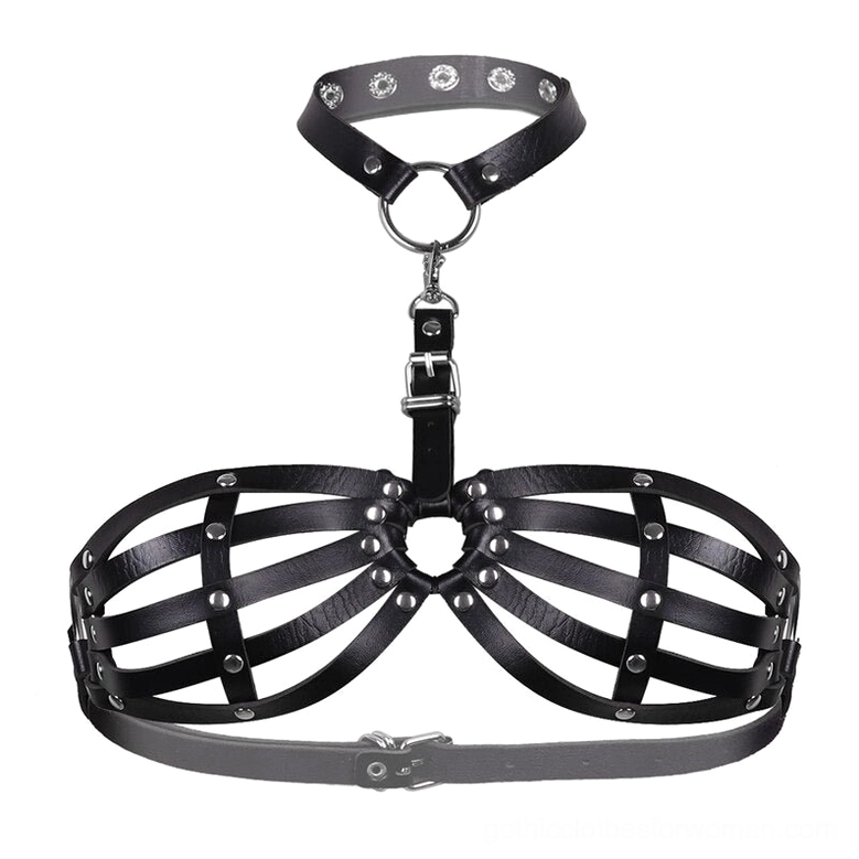 Flat lay product display of complete black leather body harness showing all components, metal D-rings, adjustable buckles, and leather strap sections