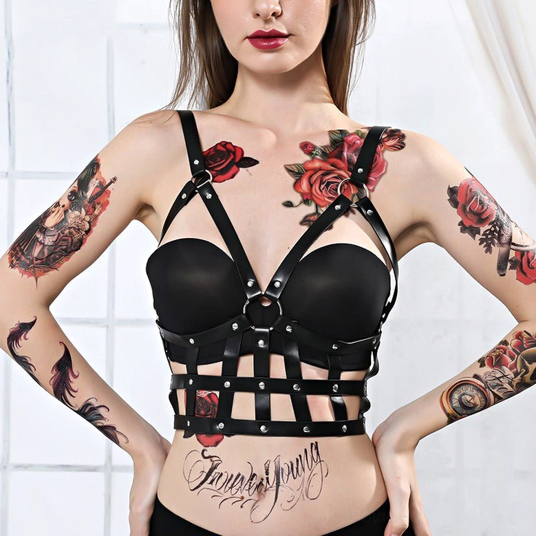 Front full view of black PU leather chest harness with central metal O-ring and crisscross design