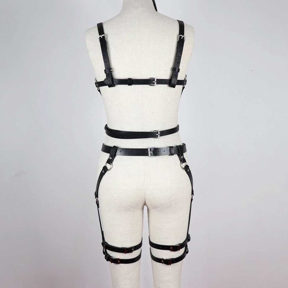 Black faux leather adjustable body harness worn with alternative outfit showing styling versatility for gothic fashion