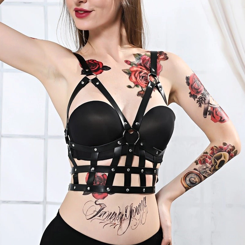 Right side front view of black leather body harness showing grid lower section and stud accents