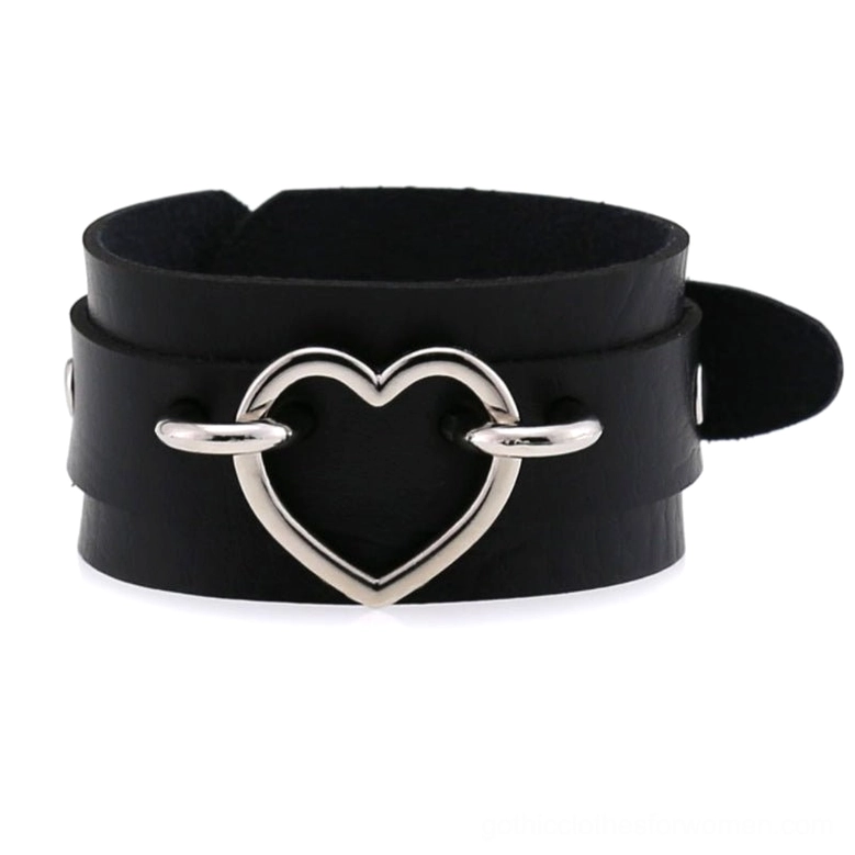 Black leather double-strap heart cuff bracelet with silver hollow heart decor and adjustable strap, front flat lay