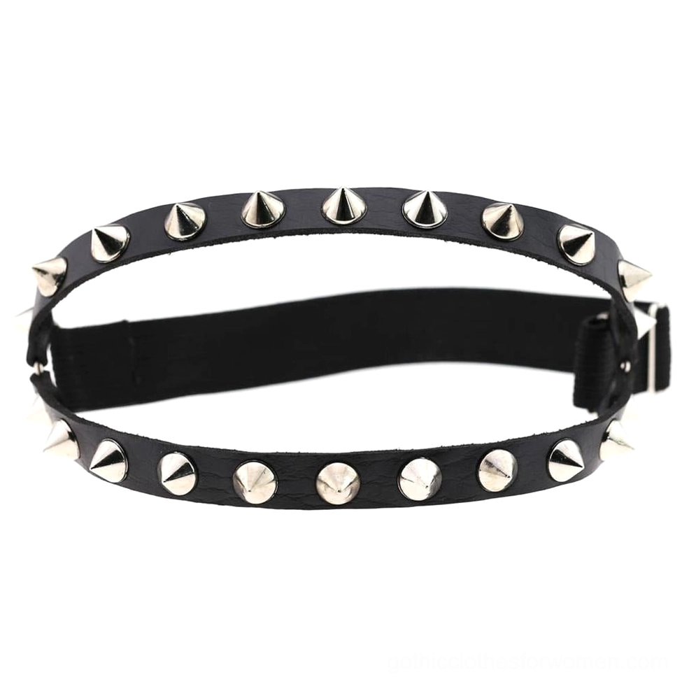Black leather spiked leg garter with silver cone and round rivets adjustable buckle closure flat lay product photography