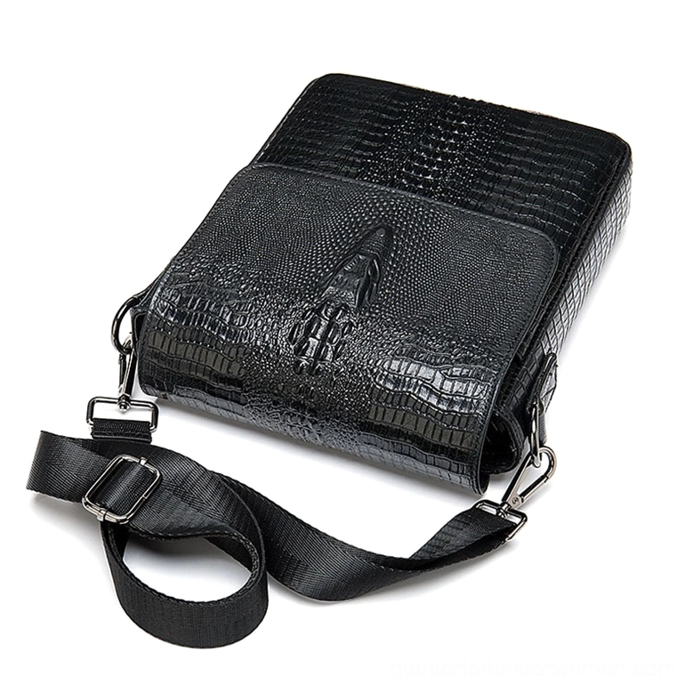 Black genuine leather messenger bag oblique side view showing detachable shoulder strap and flap design with gothic aesthetic