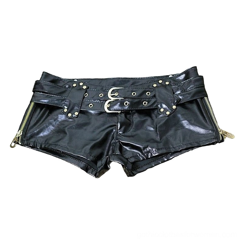 Flat lay view of black leather gothic shorts showing belt buckles, side zippers, and gold hardware details
