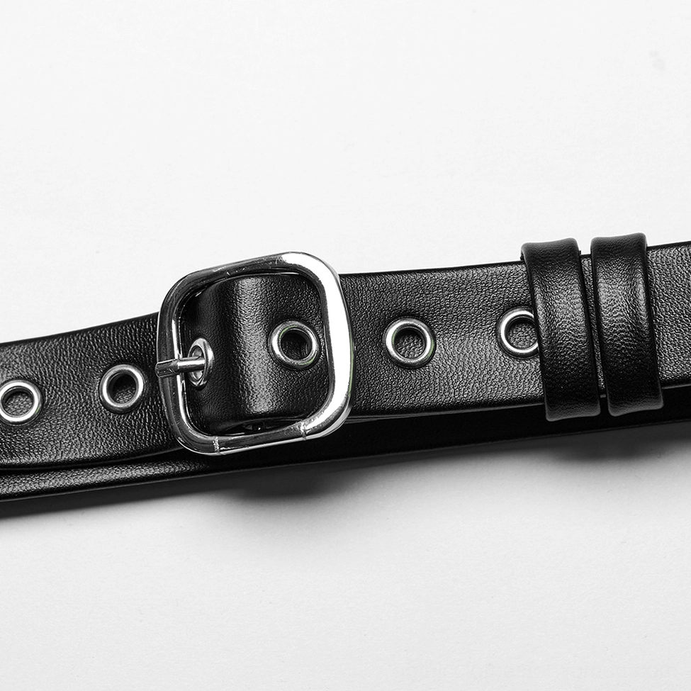 Single black PU leather strap with adjustable metal buckle and eyelet holes for customizable fit harness detail