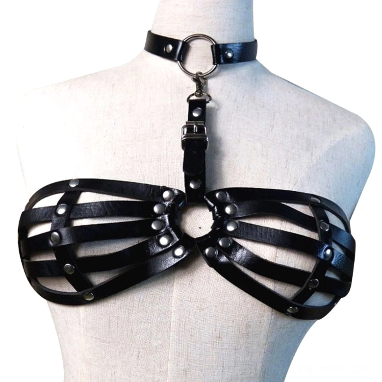 White fabric mannequin torso wearing black leather studded cage bra harness with polished metal hardware and rivet embellishments