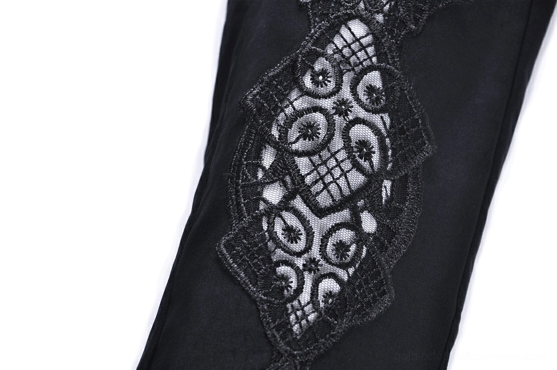 Detailed macro close-up of black gothic leggings thigh lace insert panel showing geometric floral lace design and craftsmanship