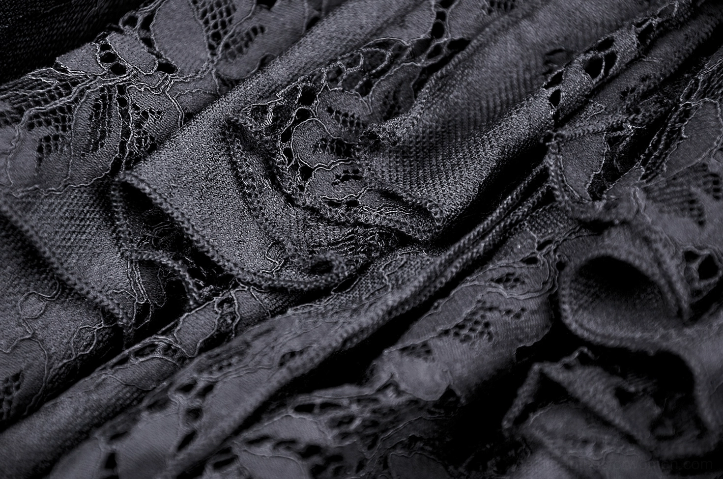 Black gothic lace mermaid skirt detail view of layered ruffle hem construction and lace panel arrangement
