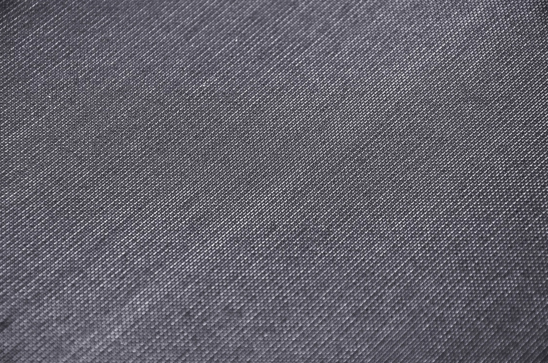 Black sheer mesh fabric texture close-up showing smooth matte woven surface and fine textile weave
