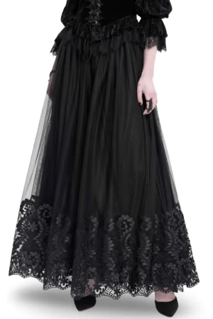 Black mesh gothic maxi skirt with embroidered floral hem, front three-quarter view on model