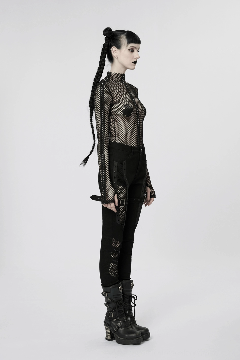 Black mesh gothic trousers design detail showcasing punk aesthetic and eyelet hardware