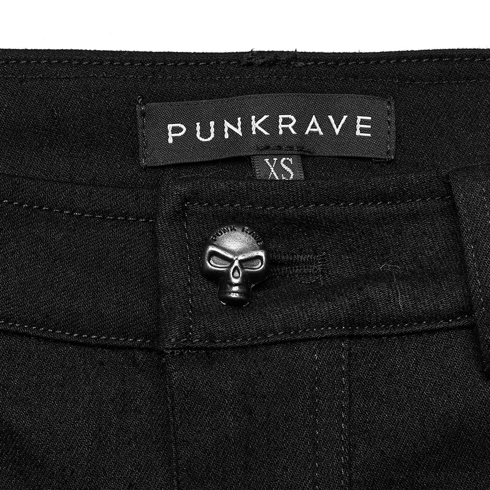 Black mesh grommet gothic skinny pants detail shot - frayed fabric trim on hollow mesh panel