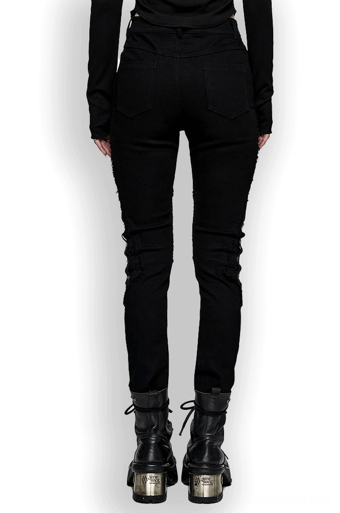Black mesh grommet gothic skinny pants back view on model - slim fit silhouette with platform boots