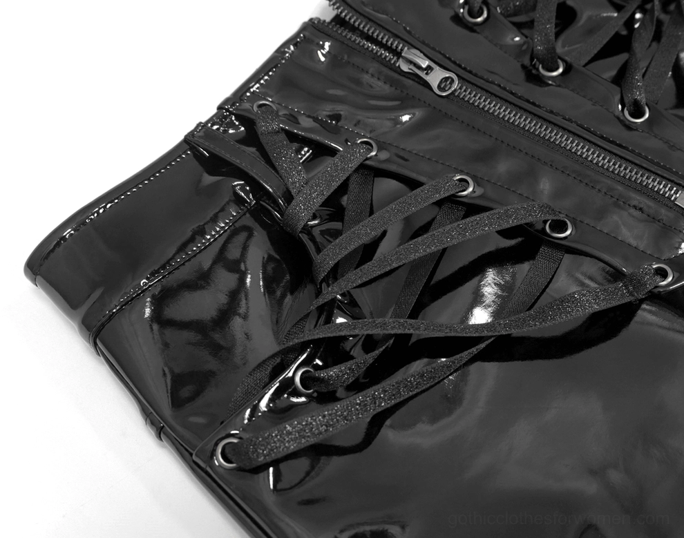Front waist close-up of black mini skirt featuring adjustable lace straps with metal grommets and vinyl texture