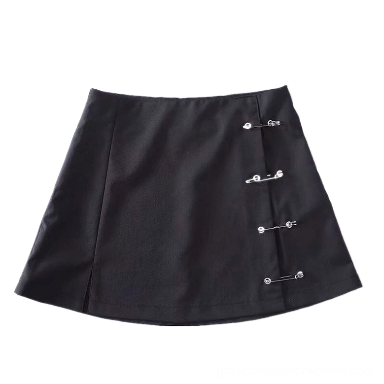 Black safety pin mini skirt flat lay overhead view displaying full a-line silhouette and metal eyelet hardware details