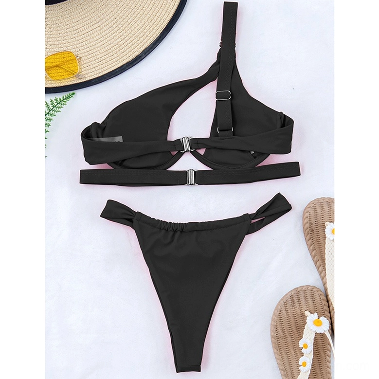 Black one-shoulder bikini side flat lay view showing adjustable shoulder strap and rear buckle