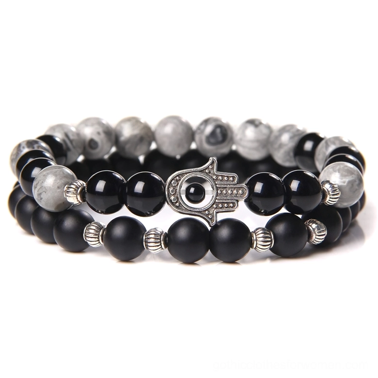 Black onyx beaded bracelet with gray stone and silver Hamsa evil eye charm - gothic minimalist style flat lay