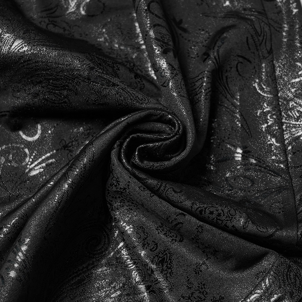 Black paisley jacquard fabric close-up texture gothic pants material