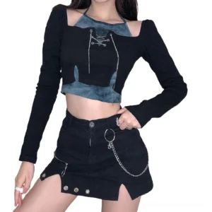 Black patchwork chain crop top with long sleeves worn by model, front full-body view showing tie-dye blue accent and layered design
