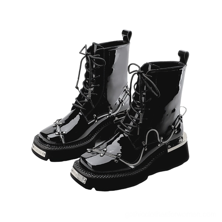 Pair of black glossy patent leather combat-style gothic boots with chunky platform sole and lace-up design, front view