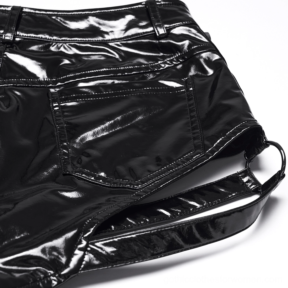 Close-up back detail of black patent shorts - showing o-ring leg strap and leather texture