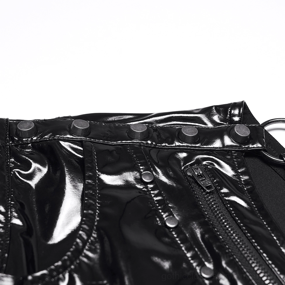 Close-up detail of black patent shorts - metal studs, zipper, and glossy leather texture