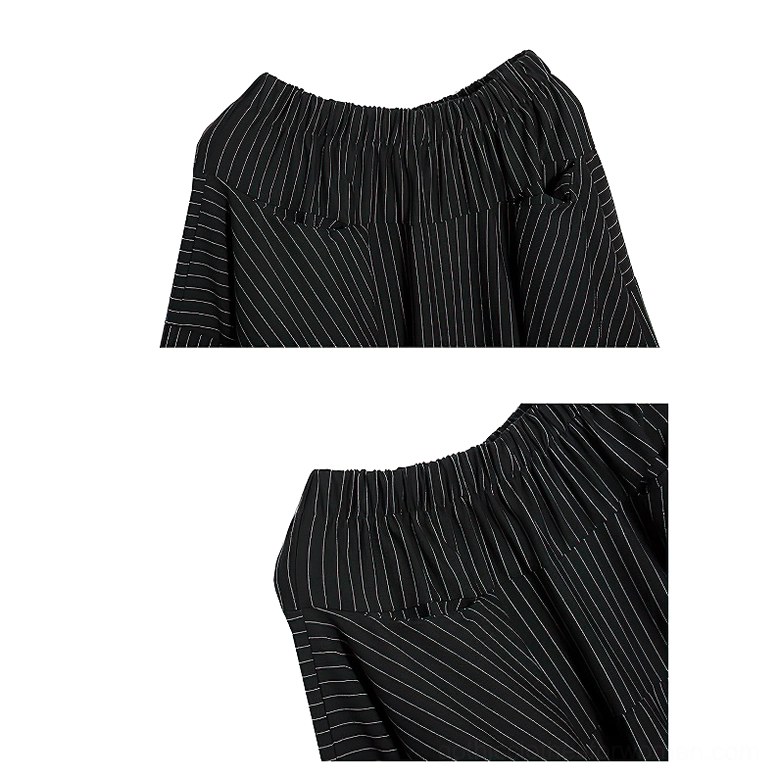 Close-up detail of elasticated waistband and pinstripe fabric texture on black gothic skirt